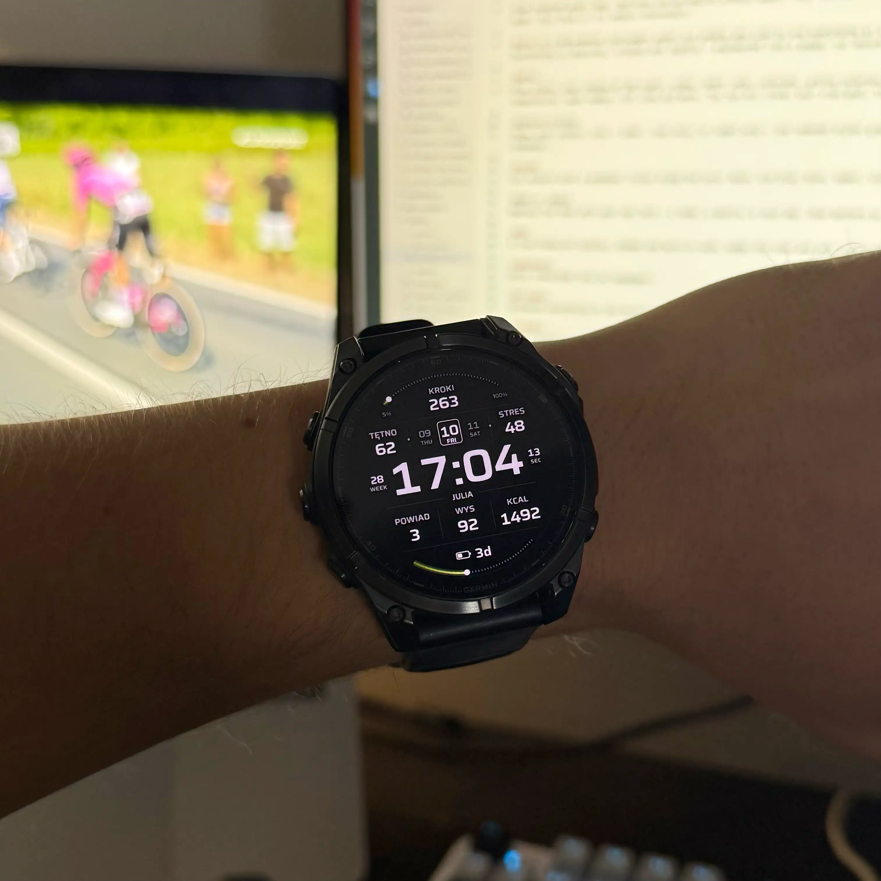 Quipu watch face on a Fenix 8 at a desk
